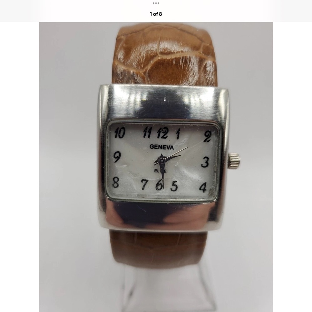 Geneva Womens cuff Silver and Brown Watch read
